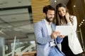 Handsome young couple with tablet in the modern office Royalty Free Stock Photo