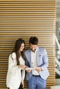 Handsome young couple with tablet in the modern office Royalty Free Stock Photo