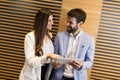 Handsome young couple with tablet in modern office Royalty Free Stock Photo