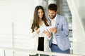 Young couple with tablet in the modern office Royalty Free Stock Photo