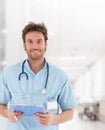 Handsome young doctor on hospital corridor