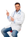 Handsome young doctor pointing