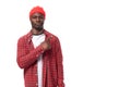 handsome young ethnic african guy in red plaid shirt telling interesting news and using gestures isolated on white