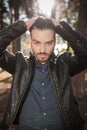 Handsome young fashion man fixing his hair Royalty Free Stock Photo