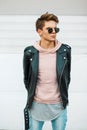 Handsome young fashionable man with a haircut in sunglasses Royalty Free Stock Photo