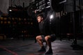 Handsome young fitness man doing weight training by lifting barbell Royalty Free Stock Photo