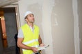 Handsome young foreman supervising a house renovation contruction site