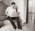 Handsome young freelancer man using laptop computer Royalty Free Stock Photo