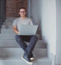 Handsome young freelancer man using laptop computer Royalty Free Stock Photo