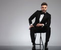 Handsome young groom smiling while wearing tuxedo