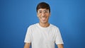 Handsome young hispanic man exuding confidence, standing casual yet cool in glasses, radiating joy while smiling at the camera Royalty Free Stock Photo