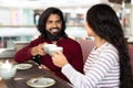 Handsome young indian guy have date with pretty lady Royalty Free Stock Photo