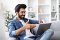 Handsome Young Indian Man Making Video Call On Laptop At Home Royalty Free Stock Photo