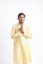 Handsome Young Indian Man Showing Namaste or welcome gesture, Isolated on White Background Royalty Free Stock Photo