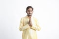 Handsome Young Indian Man Showing Namaste or welcome gesture, Isolated on White Background Royalty Free Stock Photo