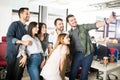 Young businessman taking selfie with team in office Royalty Free Stock Photo