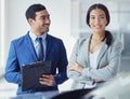 Hes the best salesman in town. a handsome young male car salesman talking to a female customer on the showroom floor. Royalty Free Stock Photo