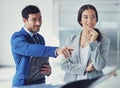 What about that one. a handsome young male car salesman talking to a female customer on the showroom floor. Royalty Free Stock Photo