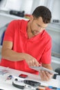 Handsome young male using tablet in office Royalty Free Stock Photo