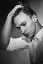 Handsome young man adjusts his wet hair Royalty Free Stock Photo