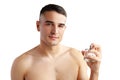 Handsome young man applying perfume on white background Royalty Free Stock Photo