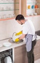 Man washing dishes Royalty Free Stock Photo