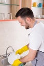 Man washing dishes Royalty Free Stock Photo