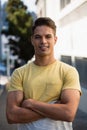 Handsome young man with arms crossed standing in city Royalty Free Stock Photo