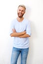 Handsome young man with beard smiling against white background Royalty Free Stock Photo