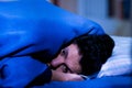 Handsome young man in bed with eyes opened suffering insomnia and sleep disorder thinking about his problem Royalty Free Stock Photo