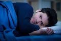 Handsome young man in bed with eyes opened suffering insomnia and sleep disorder thinking about his problem Royalty Free Stock Photo