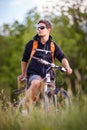 Handsome young man biking Royalty Free Stock Photo