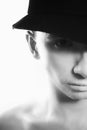 Handsome young man in black hat with white makeup Royalty Free Stock Photo