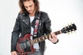 Handsome young man black leather jacket playing electric guitar Royalty Free Stock Photo