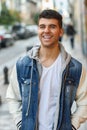 Handsome young man with blue eyes posing near a wall Royalty Free Stock Photo