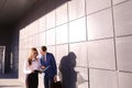 Handsome young man, businessman talking on phone, standing next Royalty Free Stock Photo