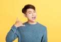 Handsome young man with calling gesture Royalty Free Stock Photo