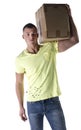 Handsome young man carrying cardboard box on shoulder Royalty Free Stock Photo