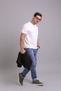 Handsome young man in casual clothes with black jacket and glasses Royalty Free Stock Photo