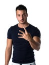 Handsome young man counting to four with fingers and hands Royalty Free Stock Photo