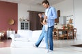 Handsome young man dancing at home with his little cute daugther Royalty Free Stock Photo