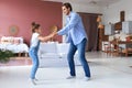 Handsome young man dancing at home with his little cute daugther Royalty Free Stock Photo