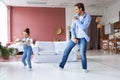 Handsome young man dancing at home with his little cute daugther Royalty Free Stock Photo