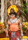 Man dressed in a traditional colorful aztec costume with feathers mask headress in Mexico-2