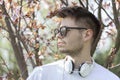 Handsome young man enjoying the beauty of the blossoming trees Royalty Free Stock Photo