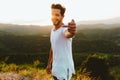 Handsome young man enjoying nature at mountain peak. Royalty Free Stock Photo