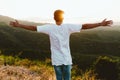 Handsome young man enjoying nature at mountain peak. Royalty Free Stock Photo