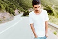 Handsome young man enjoying nature at mountain. Royalty Free Stock Photo