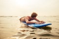 Handsome young man enjoying a surf in water.male surfer in the ocean on surf board surfing at beach, freelancer Royalty Free Stock Photo