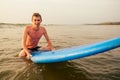 Handsome young man enjoying a surf in water.male surfer in the ocean on surf board surfing at beach, freelancer Royalty Free Stock Photo